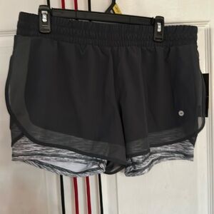 Avia woman’s workout shorts, dark gray, size L